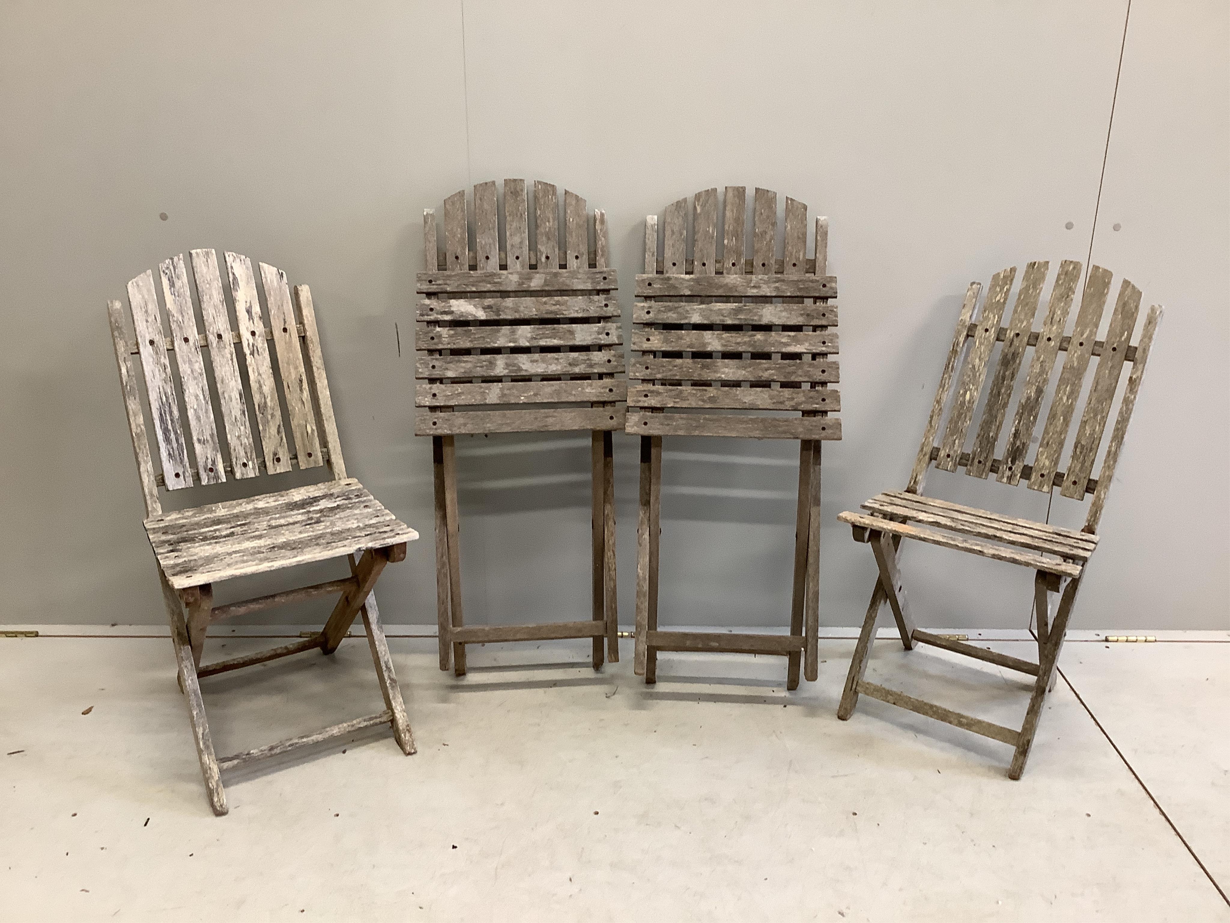 Two slatted wood folding garden tables and four chairs. Condition - very poor